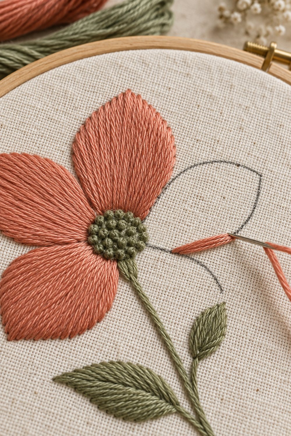 Parallel satin stitches following the shape of a curved embroidery motif